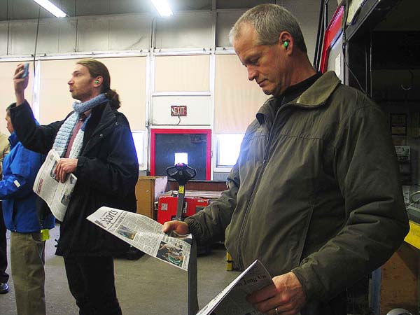 CRG board memeber Kent Kirch holds Friday's paper just fresh off the press in his hand